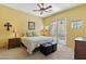 Bright bedroom with ceiling fan, access to a private balcony and neutral decor at 5370 S Desert Dawn Dr # 56, Gold Canyon, AZ 85118