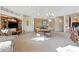 Inviting common area featuring comfortable seating, a dining area, and an entertainment center at 5370 S Desert Dawn Dr # 56, Gold Canyon, AZ 85118