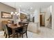 Charming dining area adjacent to the kitchen featuring tiled floors and a wooden staircase at 5370 S Desert Dawn Dr # 56, Gold Canyon, AZ 85118