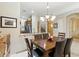 Dining room featuring a granite countertop, chandelier and open access to the kitchen at 5370 S Desert Dawn Dr # 56, Gold Canyon, AZ 85118