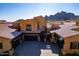 Stunning desert home with a three-car garage, mountain views, and well-maintained landscaping at 5370 S Desert Dawn Dr # 56, Gold Canyon, AZ 85118