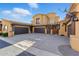 View of the exterior showcasing a multi-car garage and tile roof at 5370 S Desert Dawn Dr # 56, Gold Canyon, AZ 85118