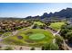 Expansive golf course view showcasing lush greens and the surrounding desert landscape and mountain views at 5370 S Desert Dawn Dr # 56, Gold Canyon, AZ 85118