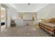 Open hallway with carpet and view to bed and seating, leading to other rooms in the home at 5370 S Desert Dawn Dr # 56, Gold Canyon, AZ 85118