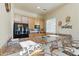 Breakfast bar with seating in kitchen, featuring updated appliances and bright natural light at 5370 S Desert Dawn Dr # 56, Gold Canyon, AZ 85118