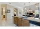 Modern kitchen with granite countertops, stainless steel dishwasher, and view into the living room at 5370 S Desert Dawn Dr # 56, Gold Canyon, AZ 85118