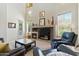Bright living room with a fireplace, media center, and comfortable seating arrangement at 5370 S Desert Dawn Dr # 56, Gold Canyon, AZ 85118