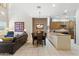 Combined living and dining area showcasing a fireplace, kitchen, and an open floor plan at 5370 S Desert Dawn Dr # 56, Gold Canyon, AZ 85118