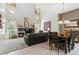 Open-concept living room featuring a fireplace, vaulted ceilings, and adjacent dining area at 5370 S Desert Dawn Dr # 56, Gold Canyon, AZ 85118