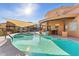Inviting community pool and spa area with seating, shade and desert landscape views at 5370 S Desert Dawn Dr # 56, Gold Canyon, AZ 85118