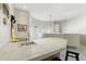 Modern wet bar area with a tiled counter and sink, ideal for entertaining and convenient refreshments at 5370 S Desert Dawn Dr # 56, Gold Canyon, AZ 85118