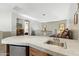 A charming wet bar featuring a tiled counter, mini fridge, and convenient sink area at 5370 S Desert Dawn Dr # 56, Gold Canyon, AZ 85118