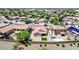 This image displays an aerial perspective of a neighborhood featuring well-kept lawns and community harmony at 597 S 167Th Dr, Goodyear, AZ 85338