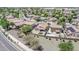 The aerial photo displays a community of single-Gathering homes with maintained yards, demonstrating community appeal at 597 S 167Th Dr, Goodyear, AZ 85338
