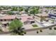 An elevated aerial shot presents a suburban landscape, with homes and green spaces under a bright sky at 597 S 167Th Dr, Goodyear, AZ 85338
