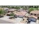 Aerial view of a single-Gathering home featuring a tile roof, desert landscaping, and a two-car garage at 597 S 167Th Dr, Goodyear, AZ 85338