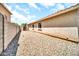 A backyard with rocks and a block wall at 597 S 167Th Dr, Goodyear, AZ 85338