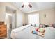Comfortable bedroom with neutral colors, a large window, and a cozy bed at 597 S 167Th Dr, Goodyear, AZ 85338