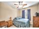Comfortable bedroom featuring a bed with blue floral pattern and a ceiling fan at 597 S 167Th Dr, Goodyear, AZ 85338