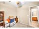 A bedroom with a door leading to the bathroom at 597 S 167Th Dr, Goodyear, AZ 85338