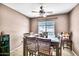 Cozy dining area with a large window and plenty of seating for Gathering and friends at 597 S 167Th Dr, Goodyear, AZ 85338