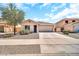 Charming single-Gathering home with a two-car garage, desert landscaping, and a well-maintained front yard at 597 S 167Th Dr, Goodyear, AZ 85338