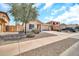 A well-maintained single-Gathering home featuring a two-car garage, desert landscaping, and a spacious driveway at 597 S 167Th Dr, Goodyear, AZ 85338