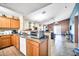 Open-concept kitchen with a breakfast bar and plenty of natural light at 597 S 167Th Dr, Goodyear, AZ 85338