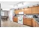 Functional kitchen with ample counter space and storage, adjacent to a bright dining area at 597 S 167Th Dr, Goodyear, AZ 85338