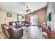 Spacious living room featuring cozy seating, stylish decor, and ample natural light at 597 S 167Th Dr, Goodyear, AZ 85338