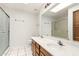 Bright bathroom features a double sink vanity, a large mirror, and a glass-enclosed shower at 6730 E Hermosa Vista Dr # 72, Mesa, AZ 85215