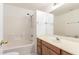 This bathroom features a tub and shower combination, a neutral sink, and wood vanity at 6730 E Hermosa Vista Dr # 72, Mesa, AZ 85215