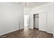 Bedroom showcases wood-look flooring, a closet, ceiling fan, and neutral walls at 6730 E Hermosa Vista Dr # 72, Mesa, AZ 85215