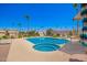 Beautiful community pool and hot tub, with lounge chairs, palm trees, and desert landscaping at 6730 E Hermosa Vista Dr # 72, Mesa, AZ 85215