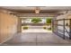 Spacious garage with ample storage cabinets and organization racks for tools and equipment at 6730 E Hermosa Vista Dr # 72, Mesa, AZ 85215