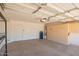 Clean, well-lit garage featuring built-in storage cabinets and ample space for vehicles and projects at 6730 E Hermosa Vista Dr # 72, Mesa, AZ 85215