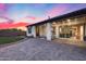 Stunning backyard features a patio, manicured lawn, and desert landscaping for outdoor entertaining and relaxation at 7415 W Lisbon Ln, Peoria, AZ 85381