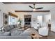 Inviting living room with a fireplace, comfortable seating, and stylish decor at 7415 W Lisbon Ln, Peoria, AZ 85381