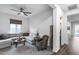 Inviting living room with a comfortable sectional sofa, stylish decor, ample seating, and plenty of natural light at 7415 W Lisbon Ln, Peoria, AZ 85381