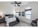 Comfortable bedroom with decorative windows, a ceiling fan, and neutral color scheme at 7415 W Lisbon Ln, Peoria, AZ 85381