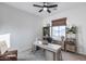 Bright office with light wood shelving, desk, a neutral palette, and a ceiling fan at 7415 W Lisbon Ln, Peoria, AZ 85381