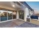 Outdoor patio featuring a built-in grill, sliding glass doors that open to the kitchen, and a concrete floor at 7415 W Lisbon Ln, Peoria, AZ 85381