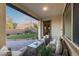 Cozy covered patio with comfortable seating, overlooking a well-maintained backyard and garden at 7415 W Lisbon Ln, Peoria, AZ 85381