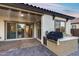 Inviting covered patio with built-in grill and serving area, perfect for outdoor entertaining with seamless indoor-outdoor living at 7415 W Lisbon Ln, Peoria, AZ 85381