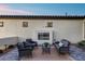 Inviting outdoor patio featuring a cozy seating area and a sleek fireplace, perfect for relaxing at 7415 W Lisbon Ln, Peoria, AZ 85381