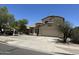 Charming two-story home featuring a tile roof, desert landscaping, and a two-car garage at 7817 S 46Th Dr, Laveen, AZ 85339