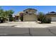 Charming two-story home featuring a tile roof, desert landscaping, and a two-car garage at 7817 S 46Th Dr, Laveen, AZ 85339