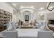 Spacious living room with elegant columns, hardwood floors, and ample seating at 8229 N Ridgeview Dr, Paradise Valley, AZ 85253