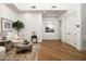 Spacious living room with hardwood floors, white walls, modern decor and beautiful arched doorways at 8229 N Ridgeview Dr, Paradise Valley, AZ 85253