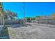 View of the flat backyard with chain link fencing at 829 E Echo Ln, Phoenix, AZ 85020